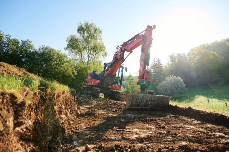 Minigraver met Siteworks Machine Guidance aan het ontgraven